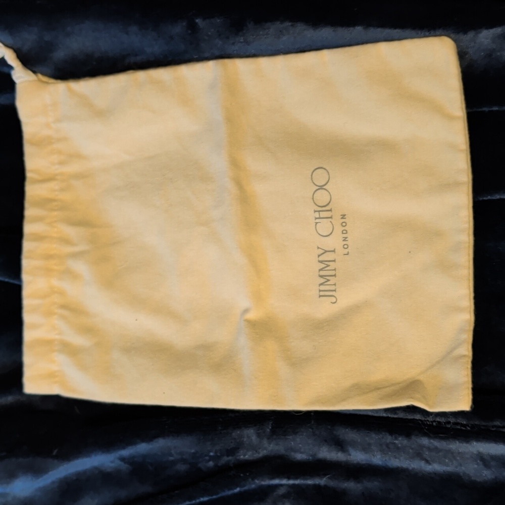 Jimmy Choo. Cream. Fits a pair of shoes or small handbag